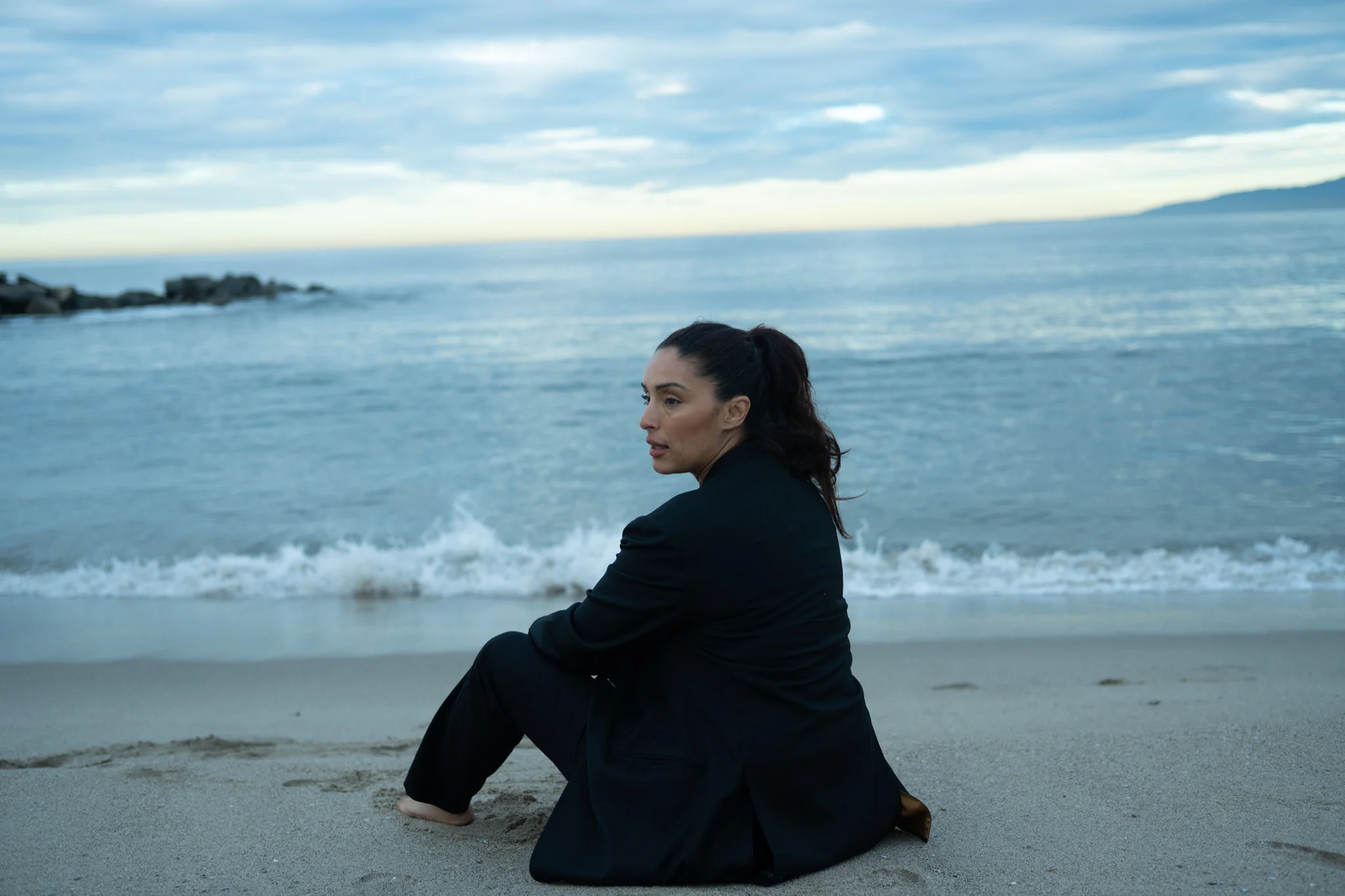 woman_sitting_beach.webp