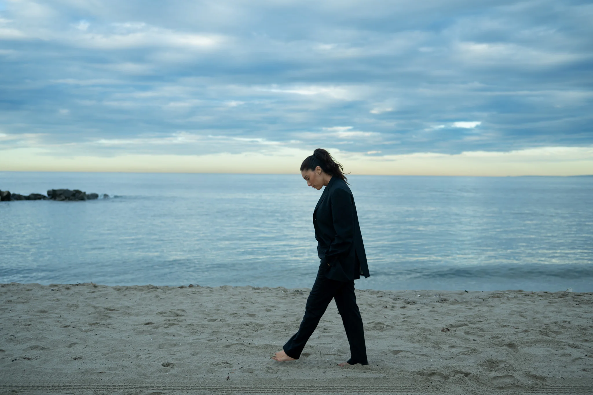 woman_walking_beach.webp